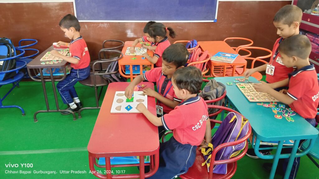 9. image of students playing with material